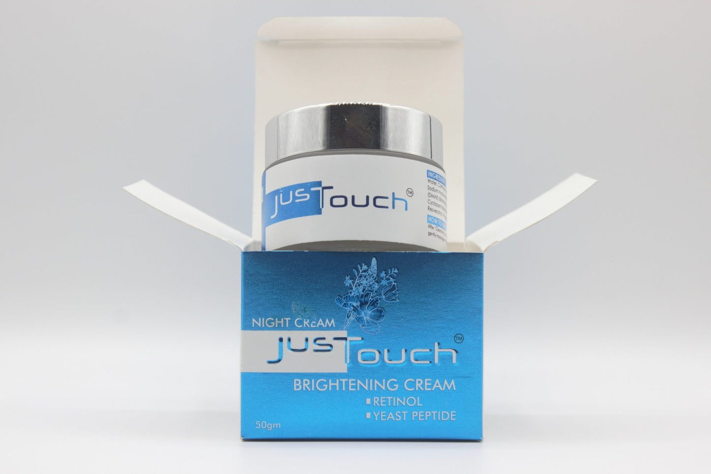 JustTouch whitening cream jar and box