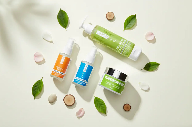 JusTouch organic skincare flat lay – serum, cream and face wash